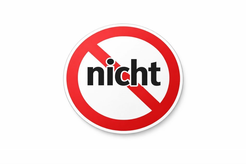 Traffic sign style illustration showing the word “nicht” crossed out, representing German negation and the position of nicht in German sentences.