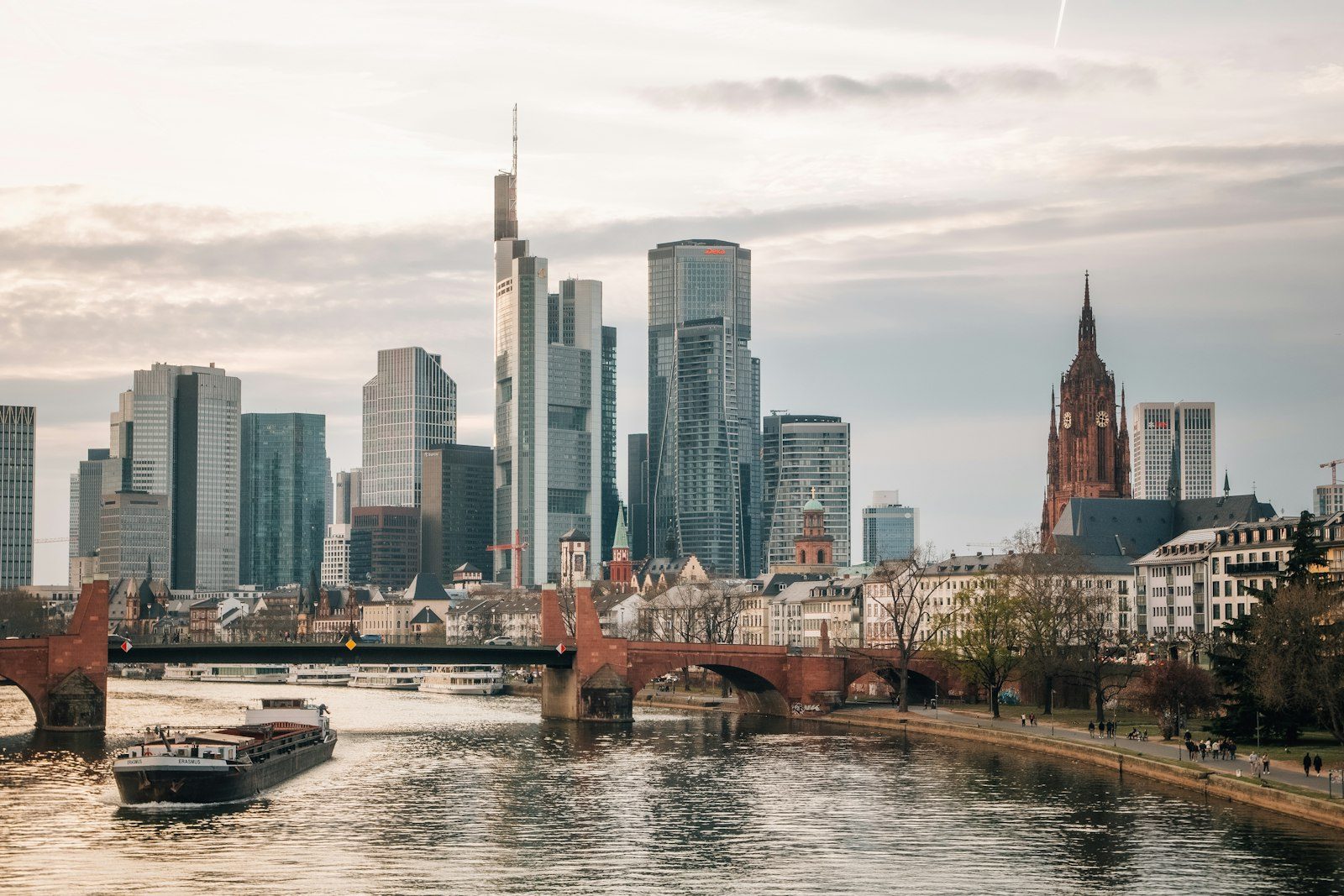 Frankfurt skyline and cathedral above the River Main, with the Old Bridge and a barge