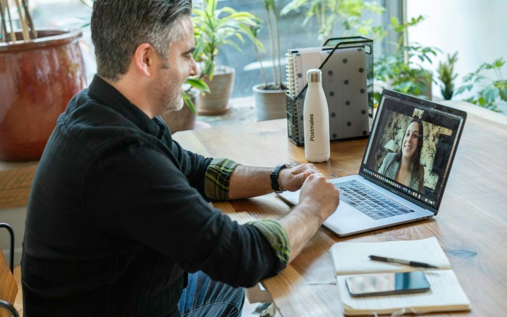 Learner at a desk in a one-to-one online German lesson with a tutor on a video call